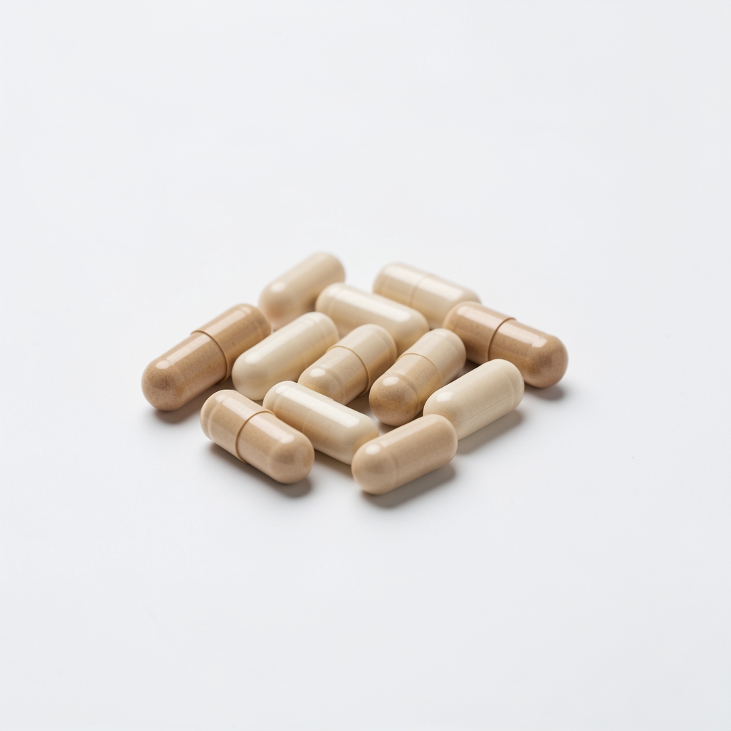 Daily supplement capsules arranged in a minimal editorial composition on white marble surface
